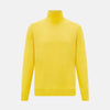View 1 of product The Turnbull & Asser Canary Yellow Fine Merino High Neck Jumper features soft merino wool, long sleeves, and a classic turtleneck design, presented on a plain white background.