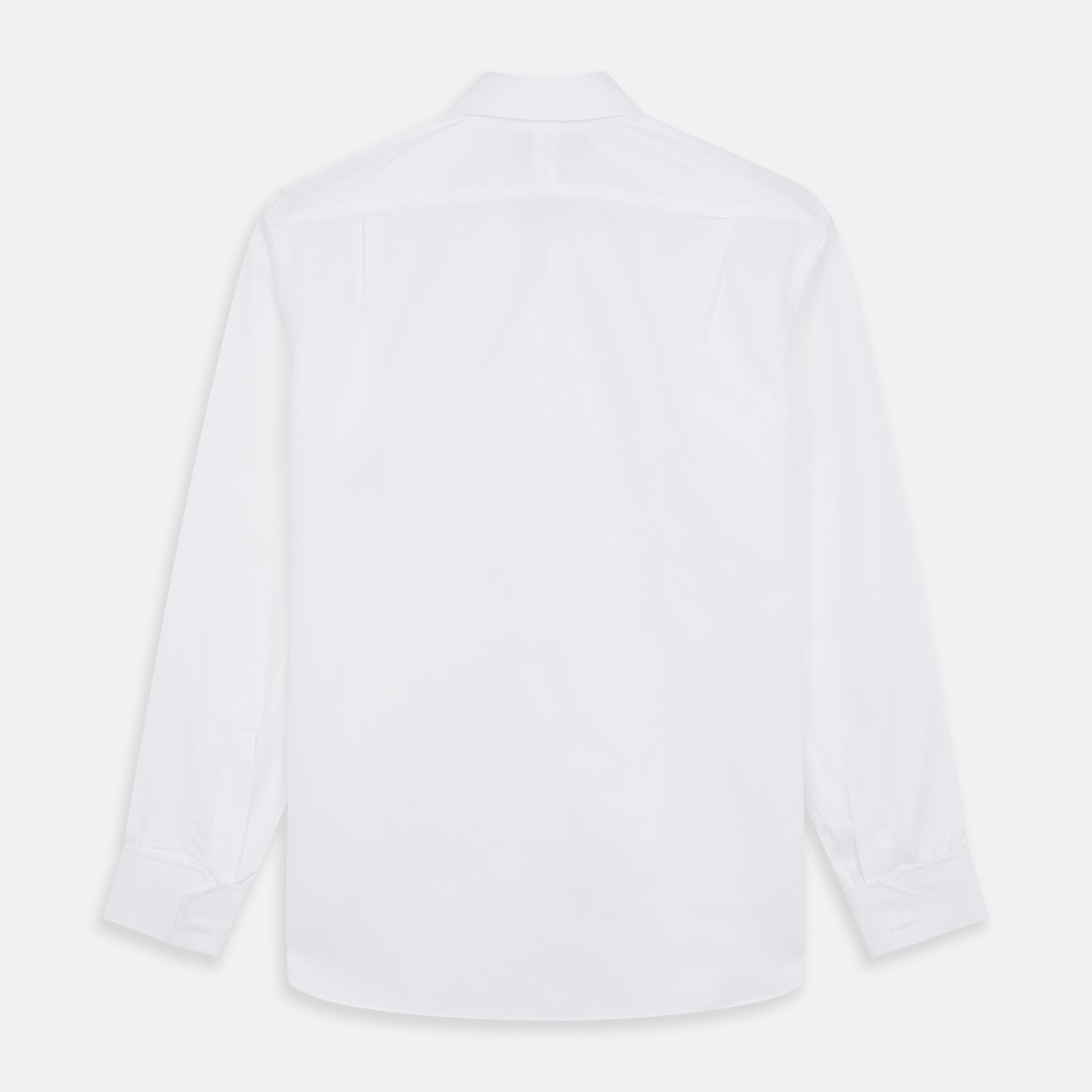 View 5 of product The Turnbull & Asser WHITE TAILORED FIT DRESS SHIRT features a pointed collar, buttoned cuffs, and a concealed button placket, shown on a plain white background.