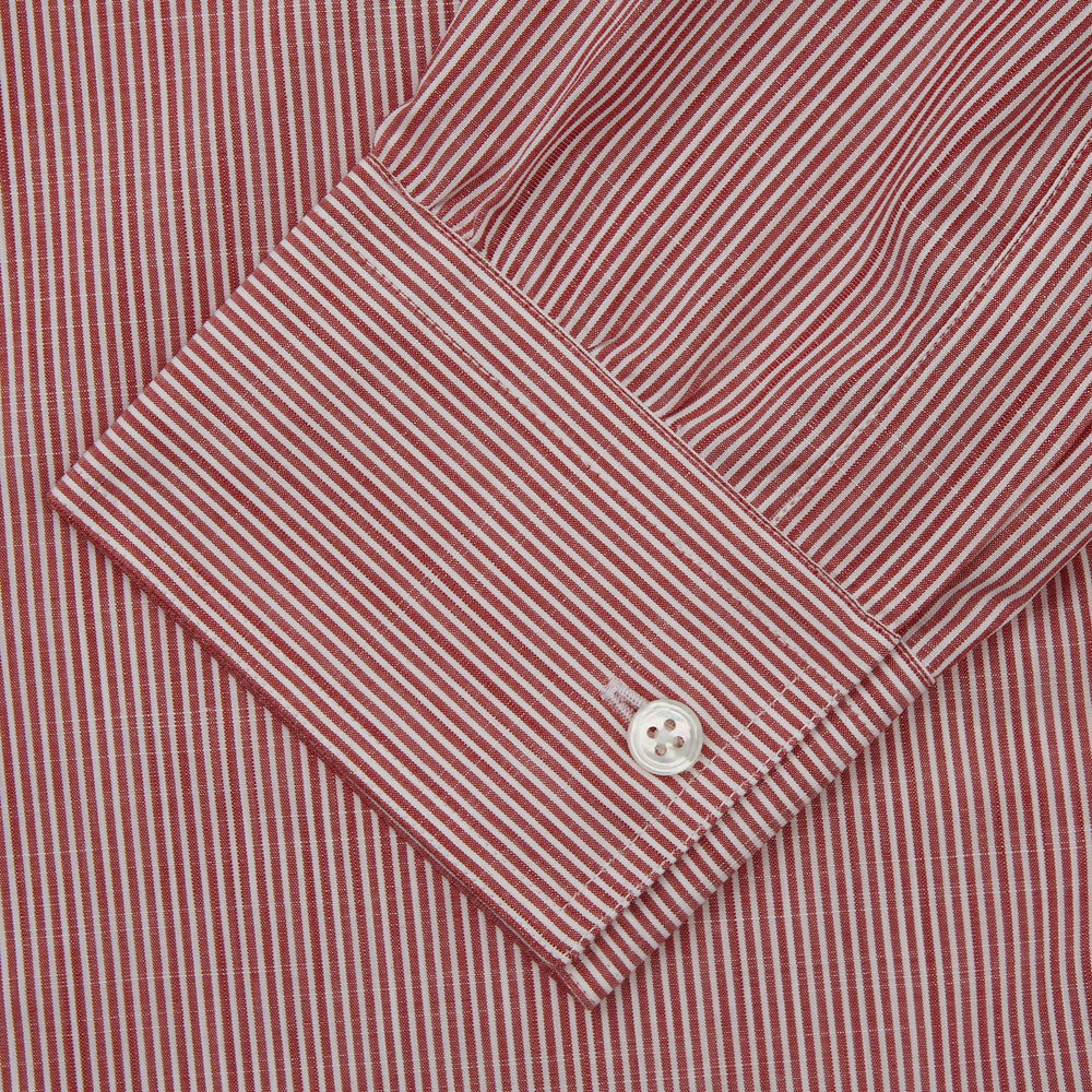 The Turnbull & Asser Dark Red Chambray Stripe Weekend Fit Shirt with a Dorset collar features striped cotton, two chest pockets with button flaps, and white front and cuff buttons—perfect for a relaxed yet stylish weekend look.