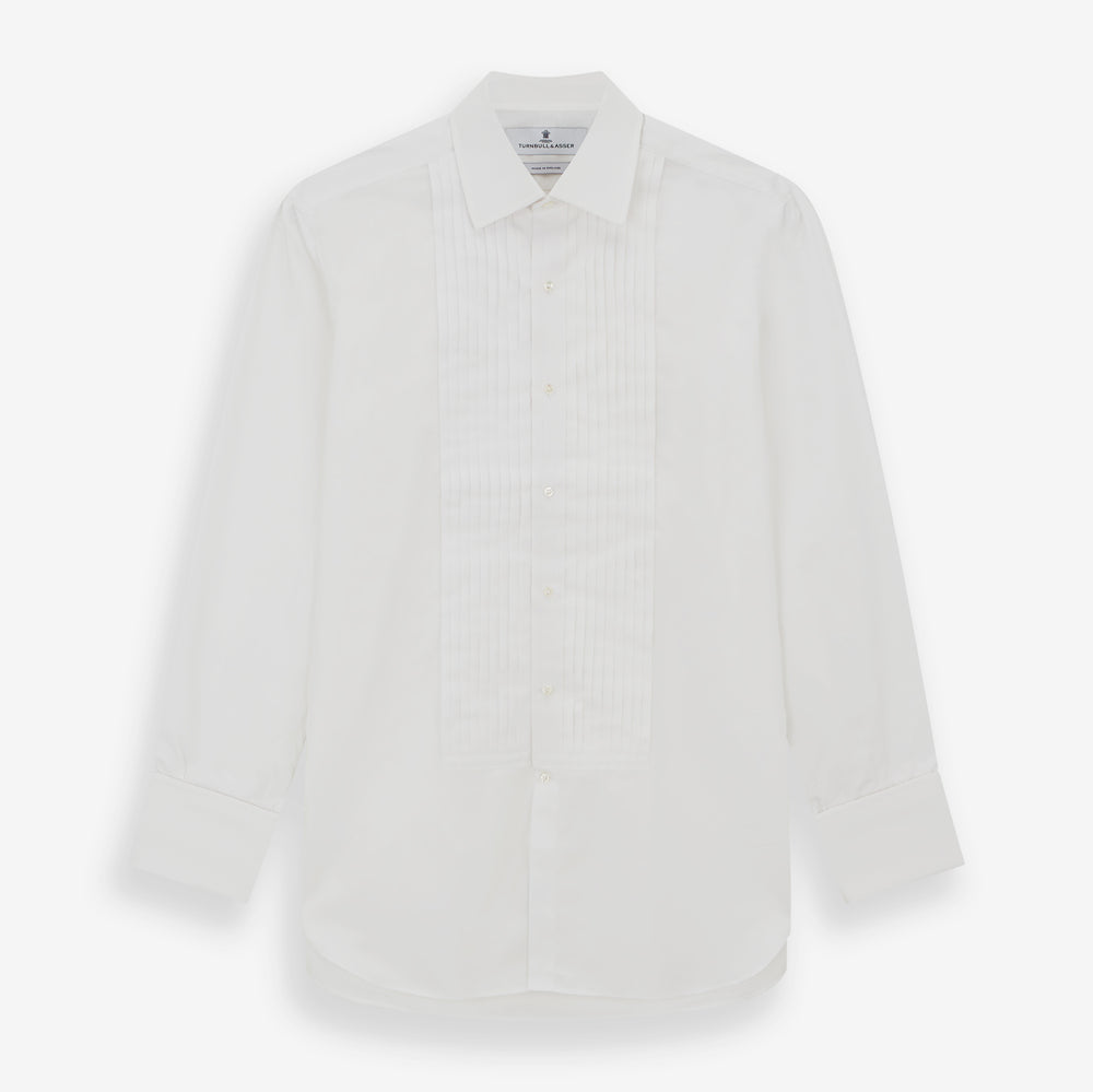 The Turnbull & Asser White Pleated Cotton Dress Shirt features a T&A collar, double cuffs, a button-down front, elegant chest pleats, and a slightly curved hem for a classic formal look.