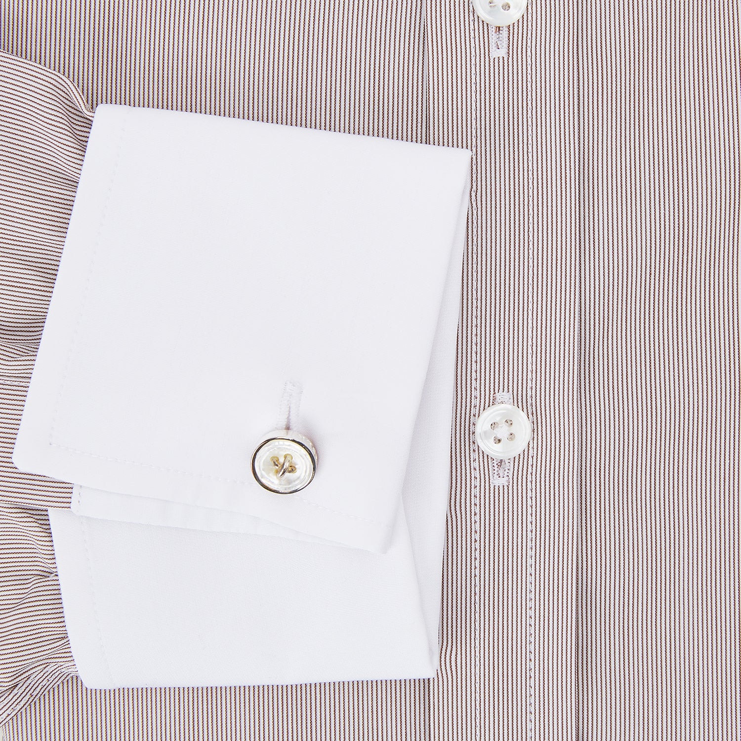 View 4 of product A Turnbull & Asser Burgundy Hairline Stripe Shirt with a contrast white collar and double cuffs, showcasing a tailored fit and button-down front, displayed against a plain white background.