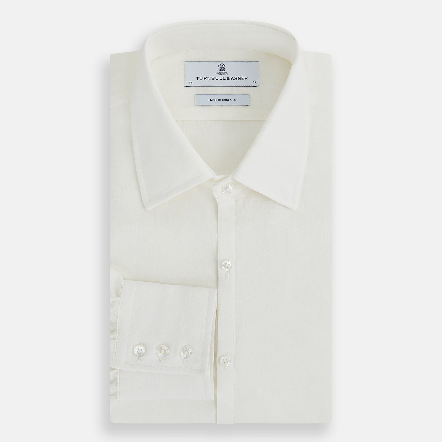 View 5 of product The Vanilla Linen Westminster Shirt by Turnbull & Asser is a long-sleeve, white button-up with a Turnbull collar, buttoned cuffs, and straight hem, highlighting British craftsmanship against a plain white background.