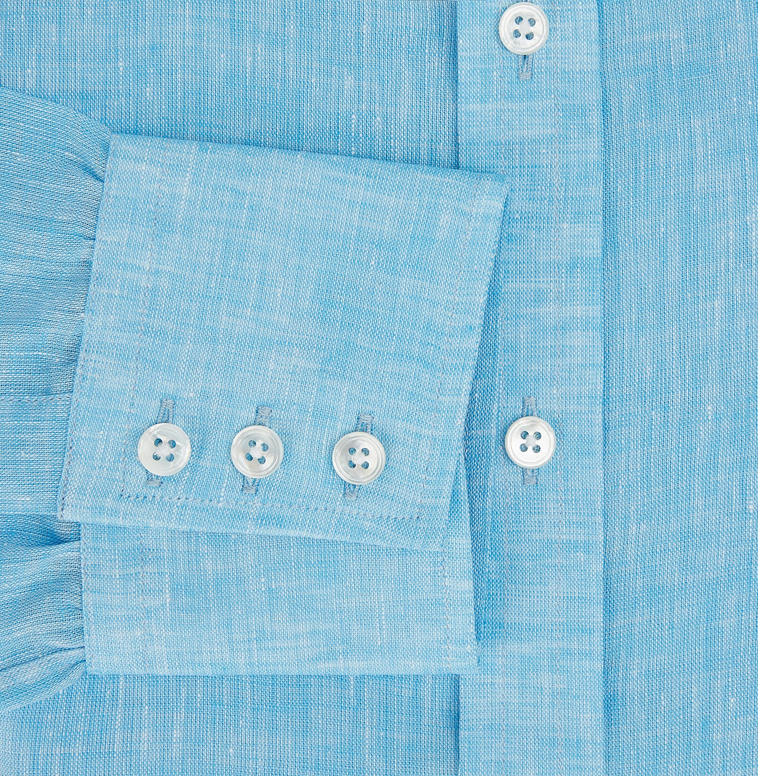 View 4 of product The Turnbull & Asser Turquoise Linen Mayfair Shirt features long sleeves and a collar, displayed neatly on a white background.