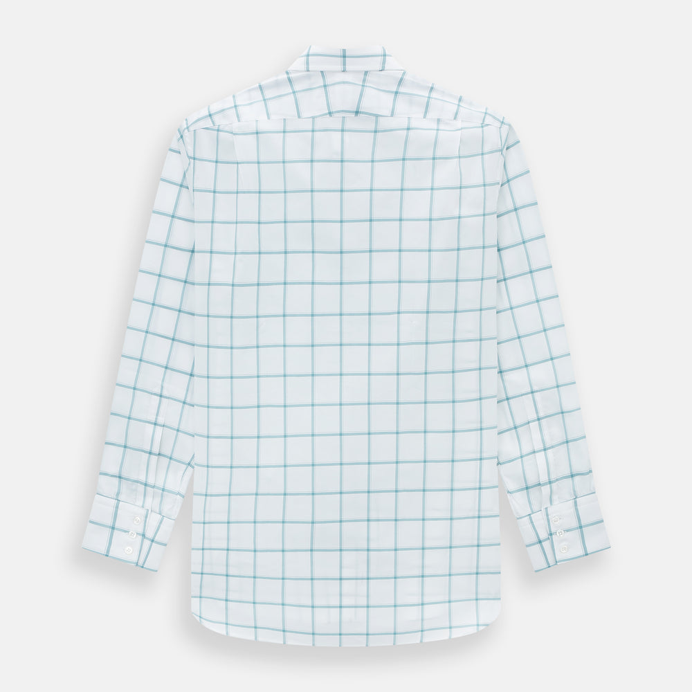 The Turnbull & Asser Sage Grid Check Mayfair Shirt is a white, long-sleeve shirt made from Italian cotton with a light blue and sage grid pattern, shown neatly laid flat on a plain, light background.