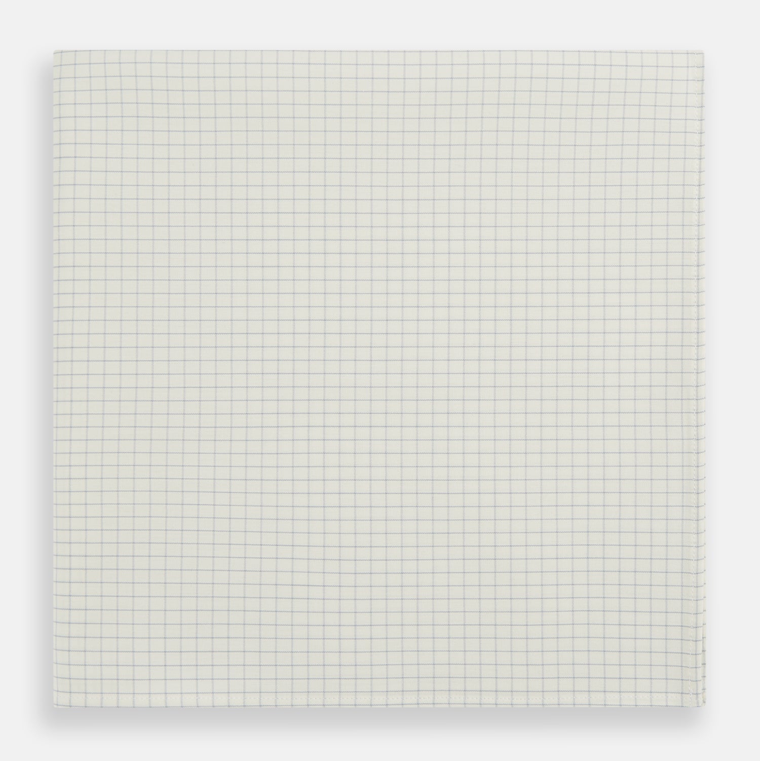 View 1 of product The Turnbull & Asser Pale Blue Graph Check Handkerchief features a refined white background with evenly spaced pale blue grid lines, evoking the minimalist elegance of classic graph paper in a luxurious accessory.