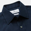 View 3 of product The Turnbull & Asser Navy Cotton Regular Fit Mayfair Shirt is a long-sleeved men’s formal shirt with a collar and white buttons, shown against a plain white background.