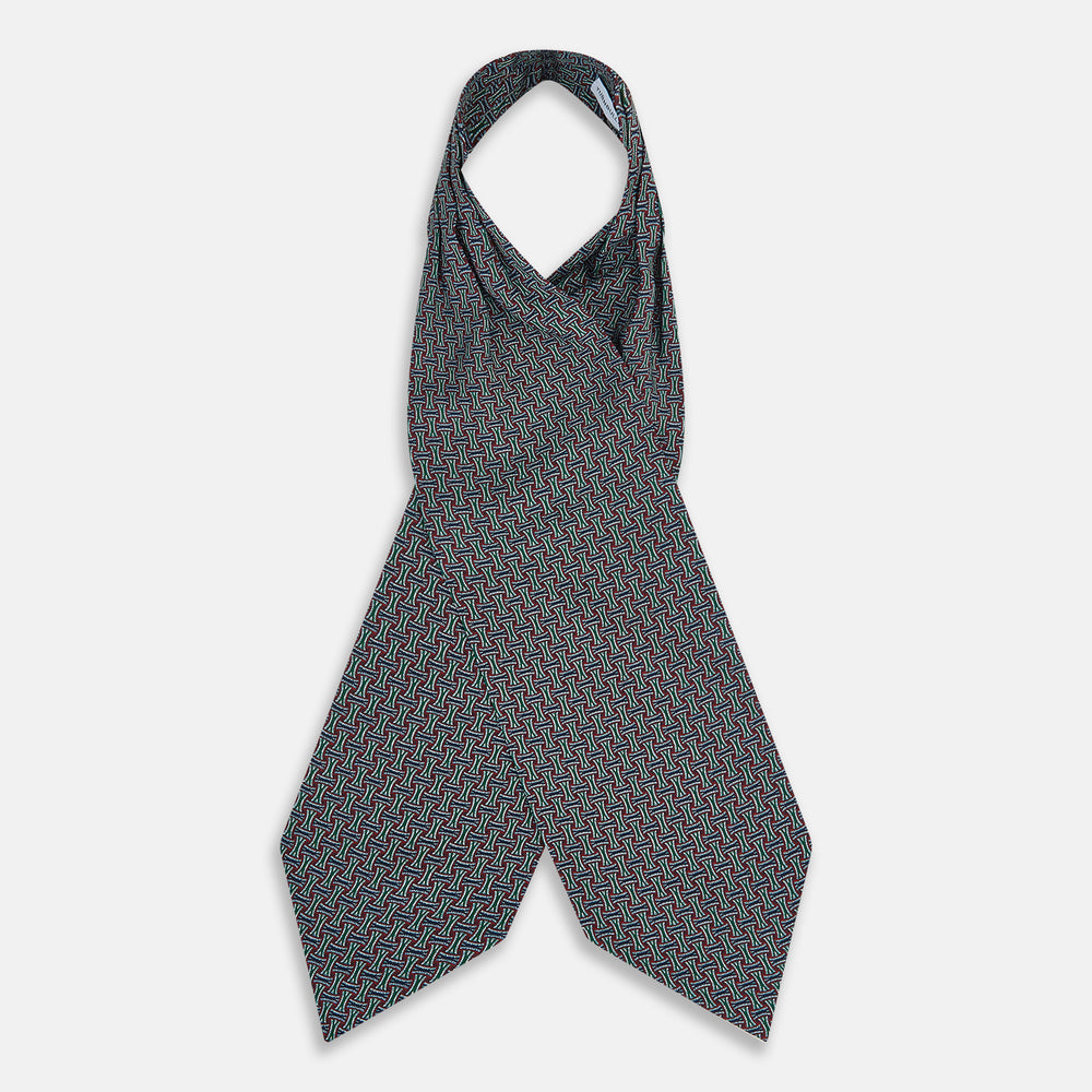 The Forest Green and Red Weave Patterned Silk Cravat by Turnbull & Asser features an elegant geometric design in rich hues, folded to a pointed end for a classic, British-inspired look.