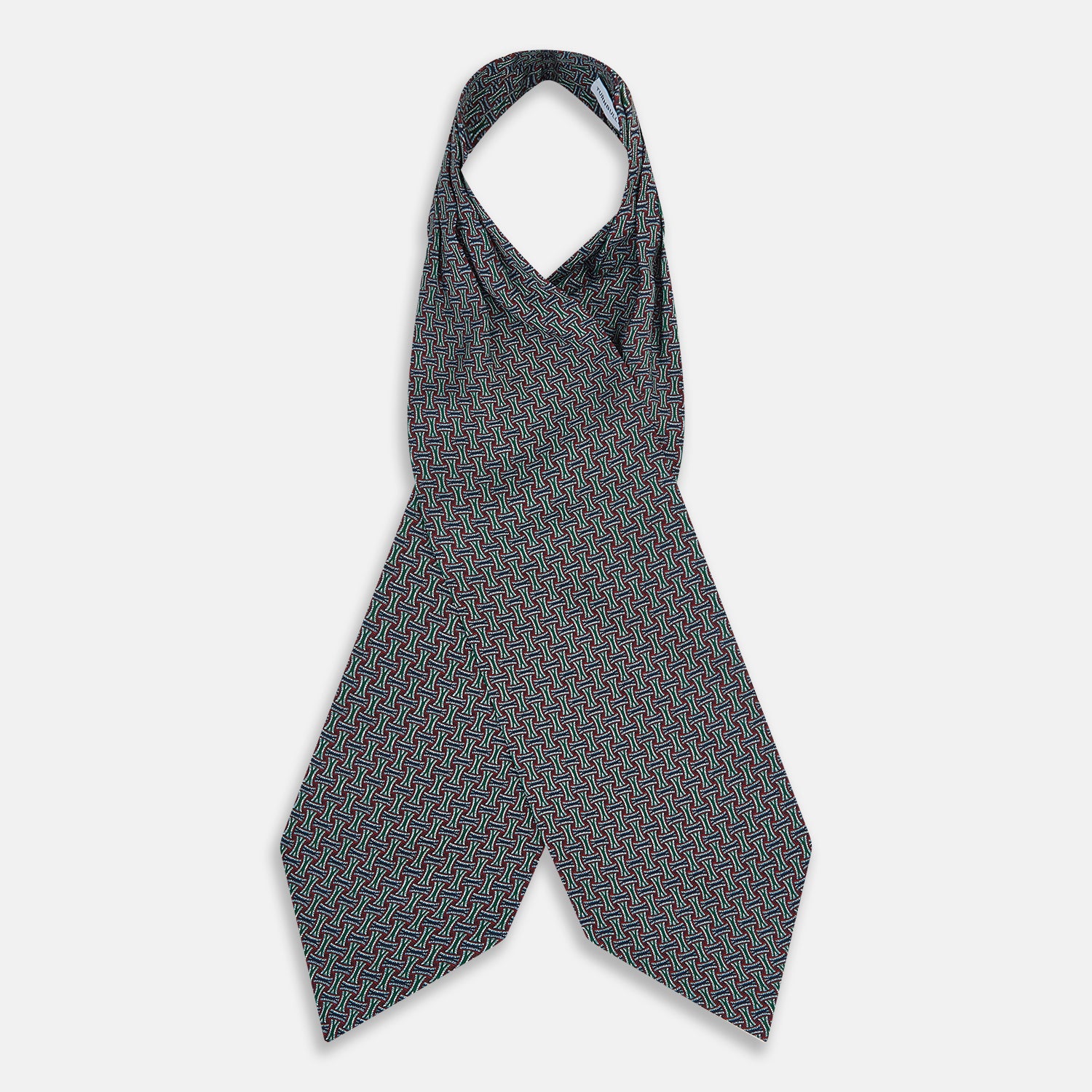 View 2 of product The Forest Green and Red Weave Patterned Silk Cravat by Turnbull & Asser features an elegant geometric design in rich hues, folded to a pointed end for a classic, British-inspired look.