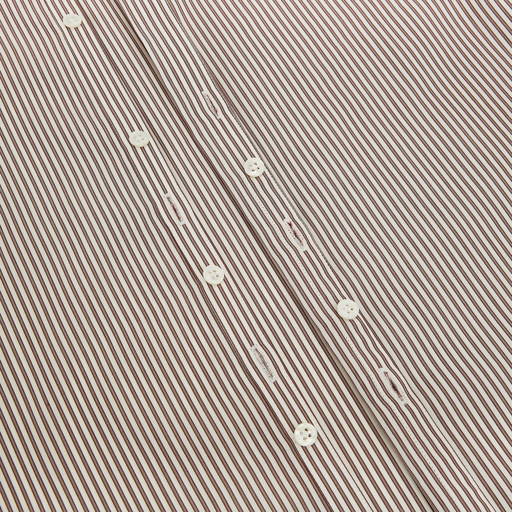 The Burgundy Halo Stripe Westminster Shirt by Turnbull & Asser features long sleeves, a button-up front, a Westminster collar, and thin vertical brown and white stripes, shown on a plain white background.