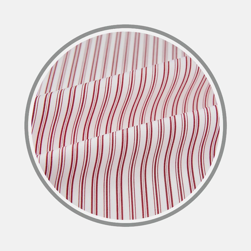 Close-up of Turnbull & Asser's Red Ticking Stripe Fabric, showing white material with thin red vertical stripes, neatly displayed in a circular frame on a light gray background.