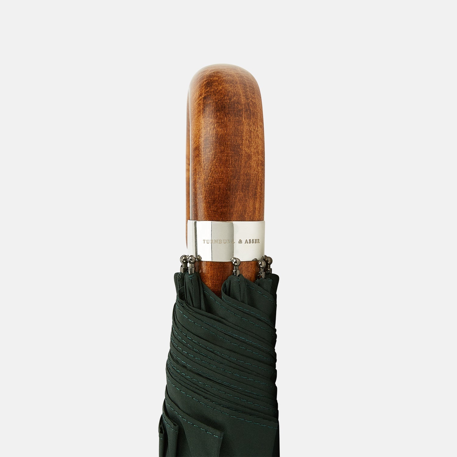 View 3 of product The Turnbull & Asser Forest Green Telescopic Umbrella features a silver shaft and a brown maple crook handle, shown fully open against a plain white background.