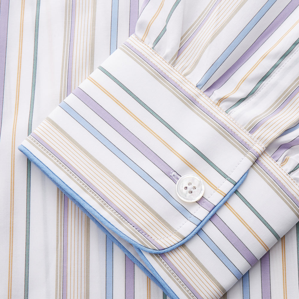 The Turnbull & Asser Colourful Garden Multi Stripe Cotton Sussex Nightshirt is UK-made, featuring vibrant stripes on white for timeless style and luxurious sleepwear comfort.