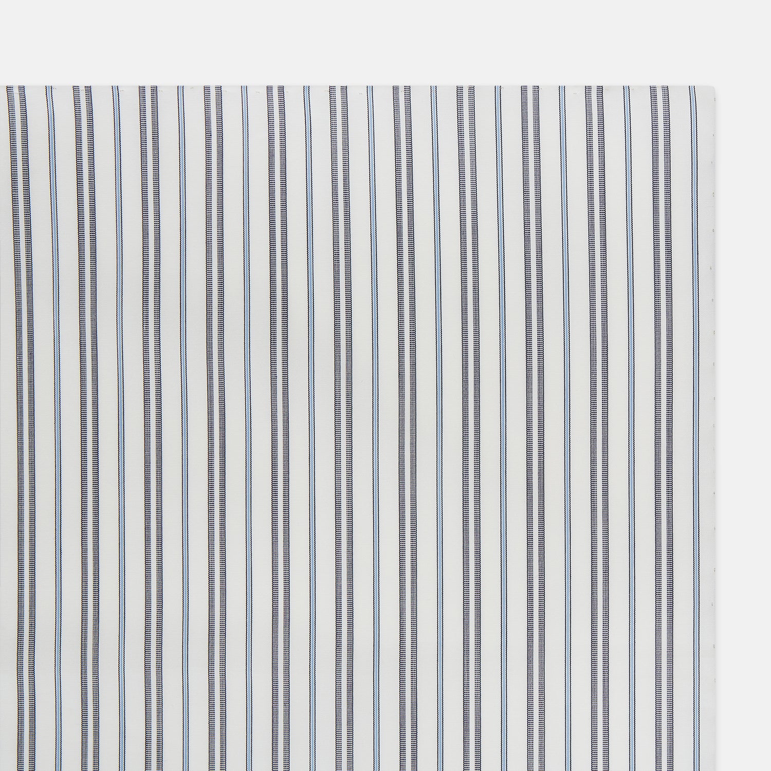 View 2 of product The Turnbull & Asser Navy and Light Blue Track Stripe Hand-Rolled Handkerchief features vertical stripes in blue, black, and gray on white with hand-rolled edges, expertly crafted in England.