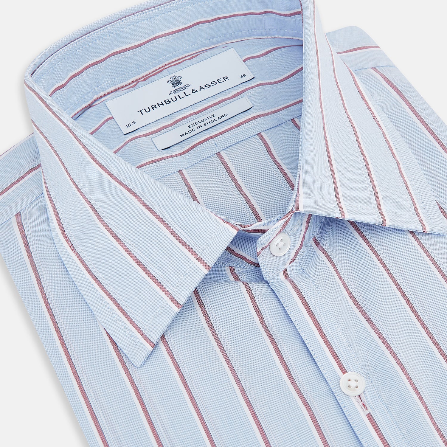 View 2 of product The Turnbull & Asser Blue and Burgundy Multi-Stripe Westminster Shirt features a pointed collar and long sleeves, laid flat on a white background to highlight its fine British craftsmanship.