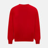 View 3 of product The Turnbull & Asser Red Merino Round Neck Jumper features long sleeves, ribbed cuffs and hem—a classic men's knitwear essential shown on a white background.