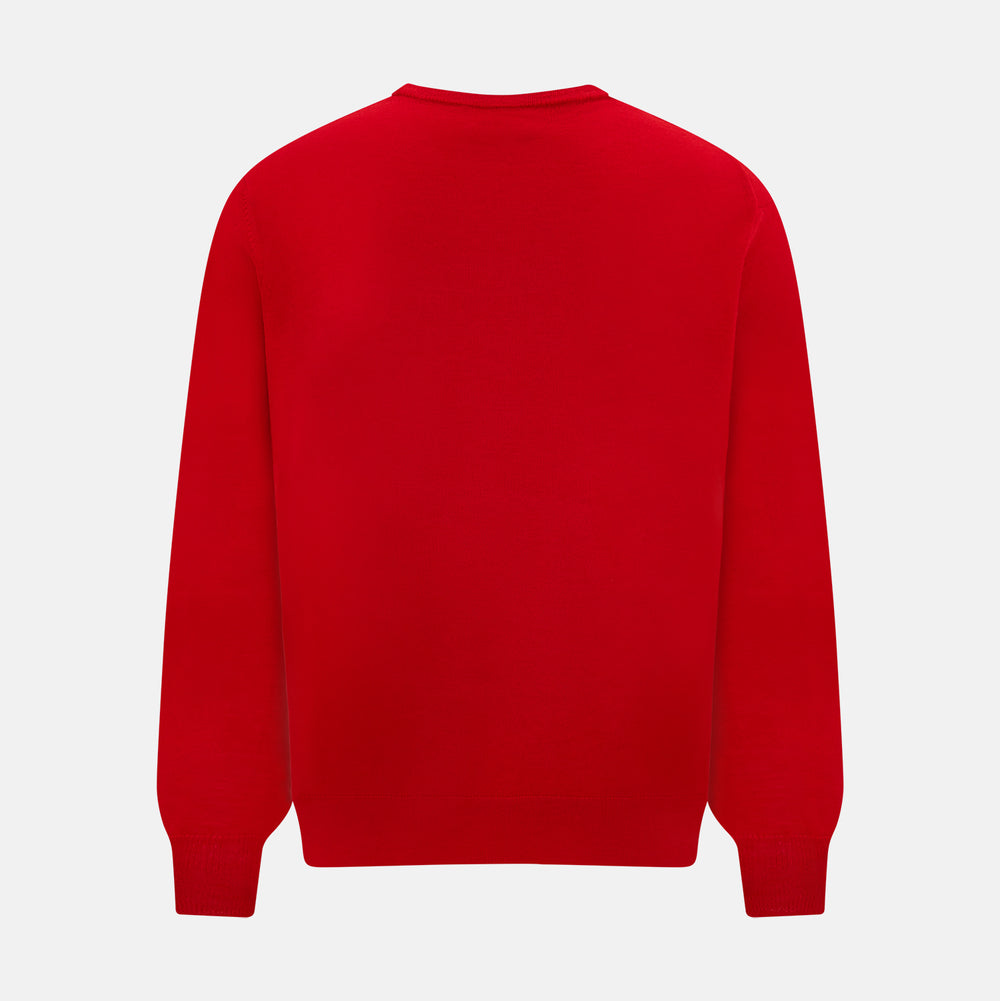 The Turnbull & Asser Red Merino Round Neck Jumper features long sleeves, ribbed cuffs and hem—a classic men's knitwear essential shown on a white background.