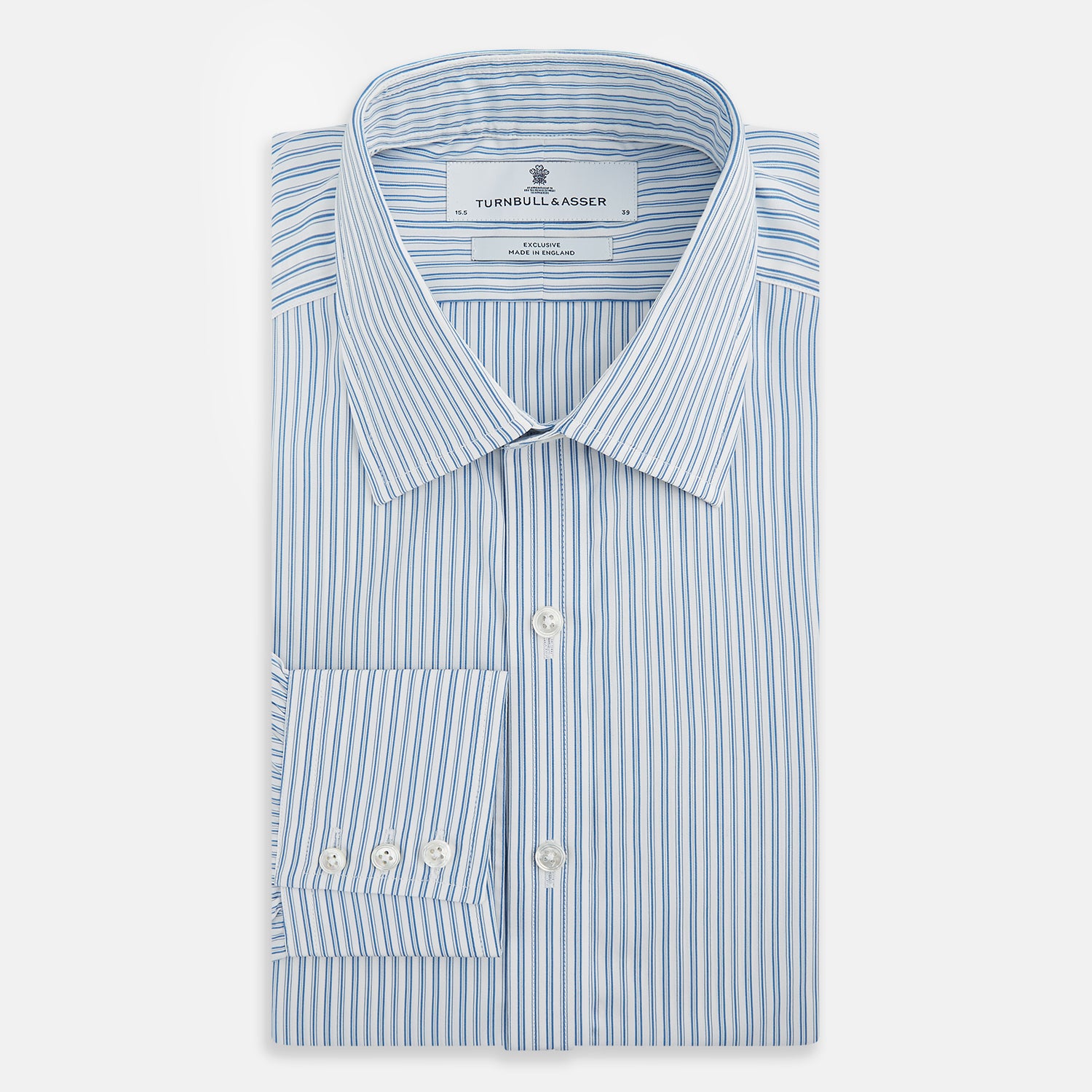 View 5 of product The Turnbull & Asser Sky Blue Double Stripe Mayfair Shirt features sky blue and white vertical stripes, a T&A collar, buttoned cuffs, and is displayed flat on a white background.