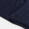 View 5 of product The Turnbull & Asser Navy Quilted Hood with Neck Warmer features diamond pattern stitching, a structured hood, overlapping collar, and button closure, shown on a plain white background.