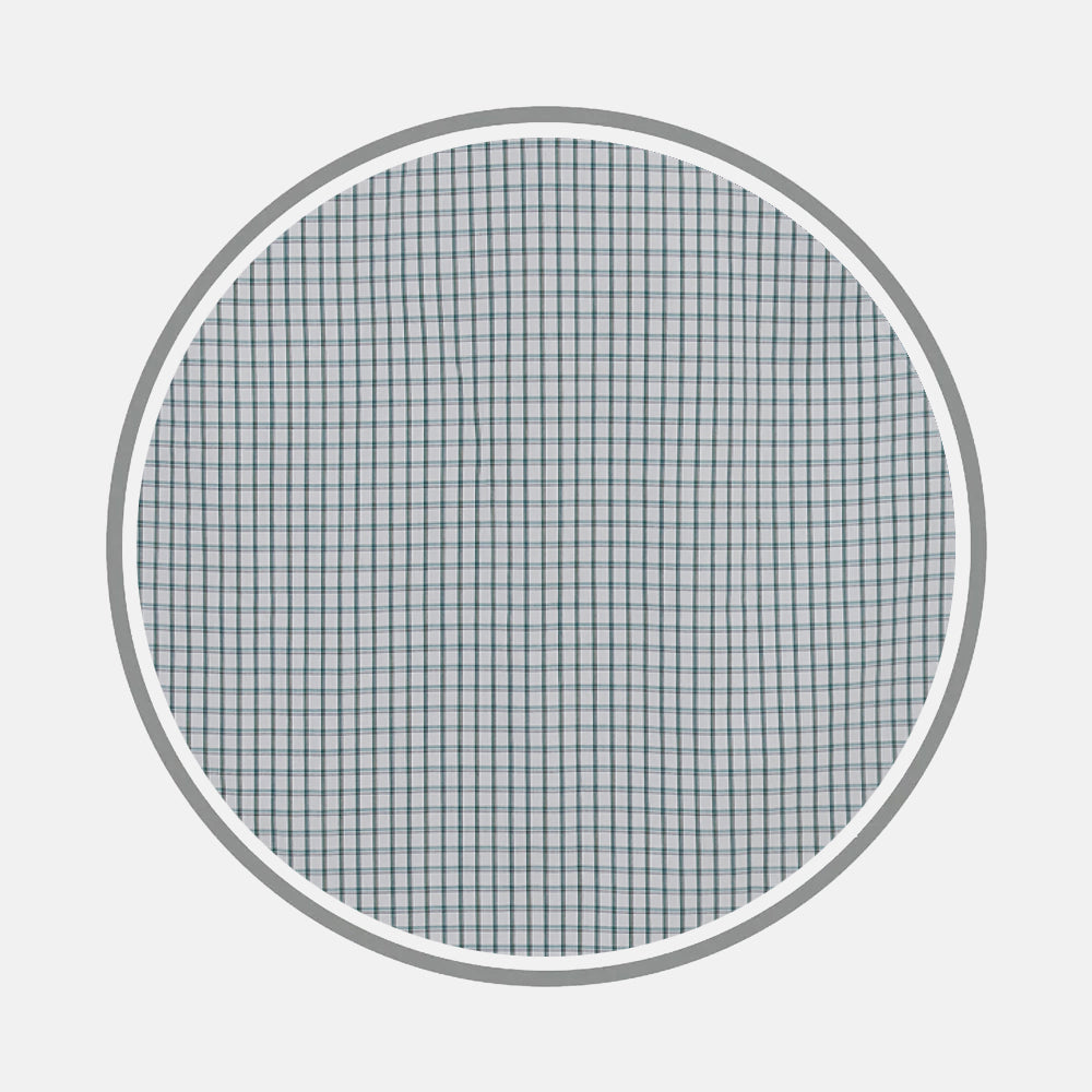 A close-up of Turnbull & Asser’s Dark Green Tattersall Check Fabric shows its circular shape and fine check pattern, set against a plain white background.