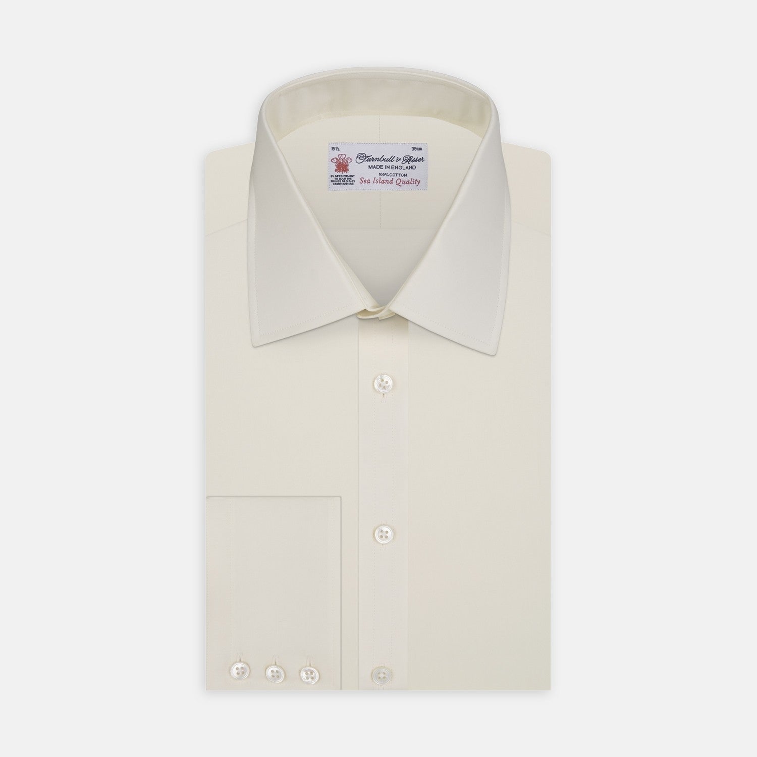 View 2 of product A close-up of Turnbull & Asser’s Cream Sea Island Quality Cotton Fabric is shown in a circular frame with a gray border, emphasizing its smooth texture and subtle stitching on the right side.