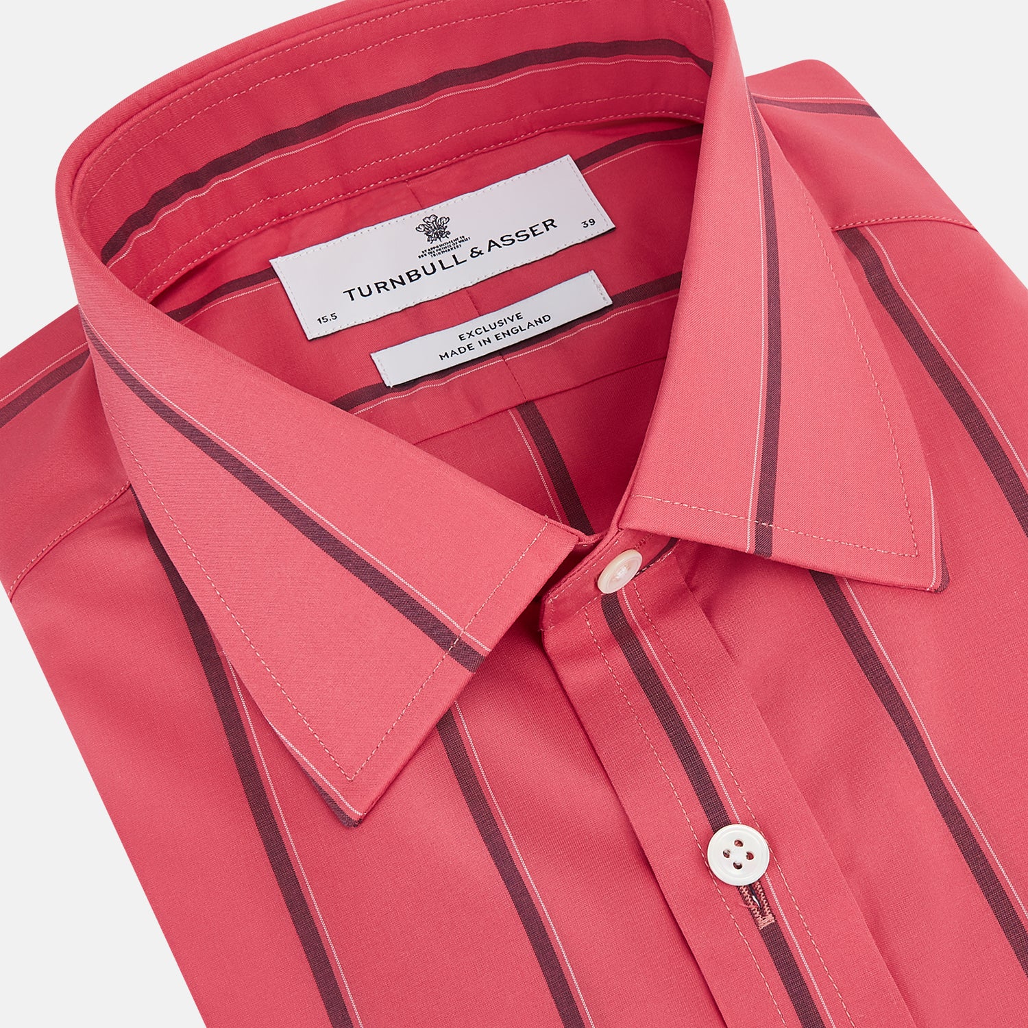 View 2 of product The Coral Red Track Stripe Mayfair Shirt by Turnbull & Asser features long sleeves, button-up front, a classic T&A collar, and buttoned cuffs in vibrant Italian cotton with vertical black pinstripes, shown on a plain white background.