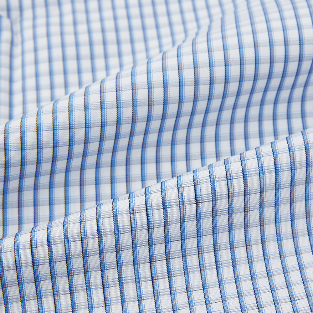 The Sky Blue Micro Shadow Check Mayfair Shirt by Turnbull & Asser features long sleeves, a classic collar, buttoned cuffs, and a light blue and white micro check pattern—showcasing refined British craftsmanship.