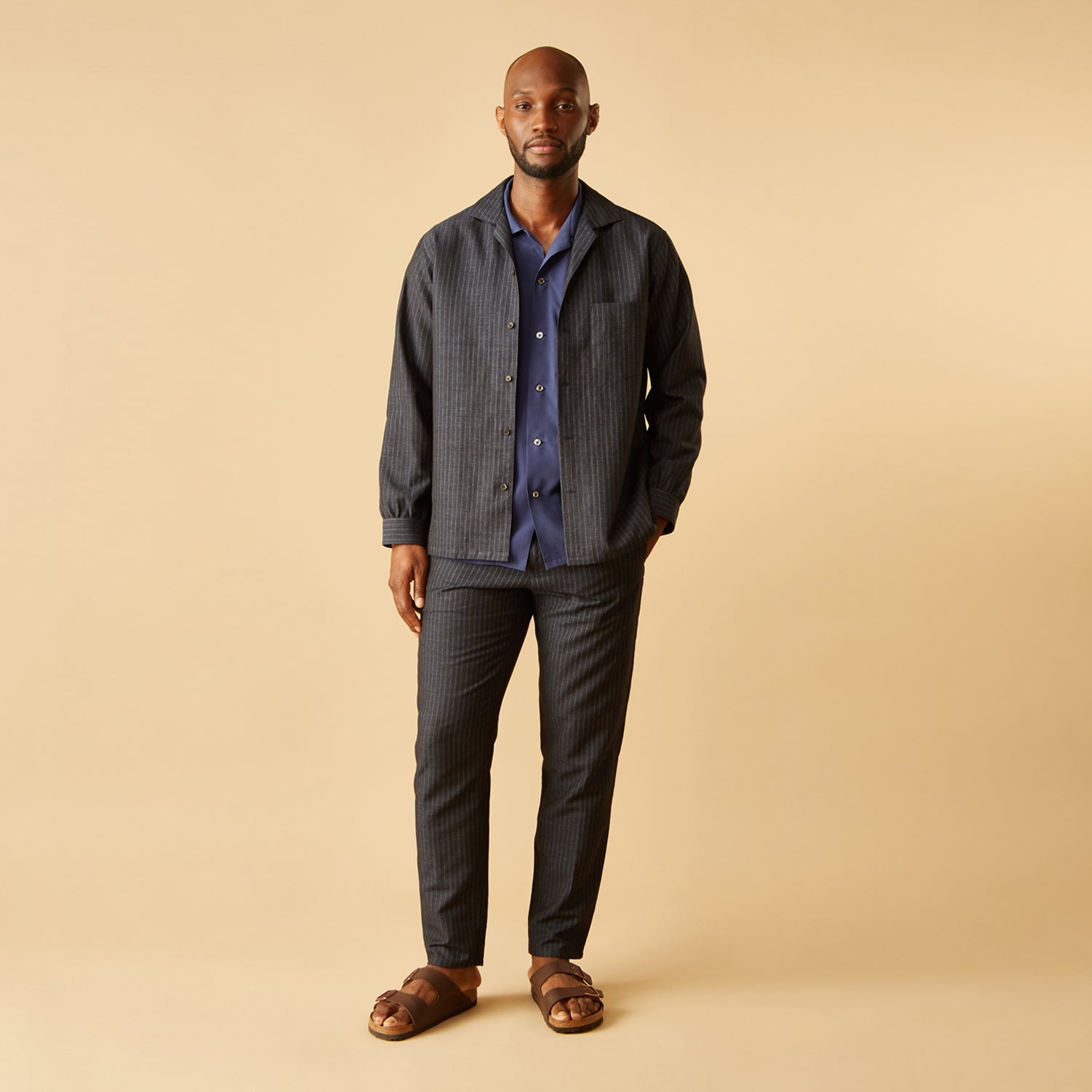 View 2 of product The Navy Tailored Pinstriped Shirt Jacket by Turnbull & Asser is a smart-casual, lightweight cotton-linen piece with long sleeves, a collar, left chest pocket, and front buttons for easy style.
