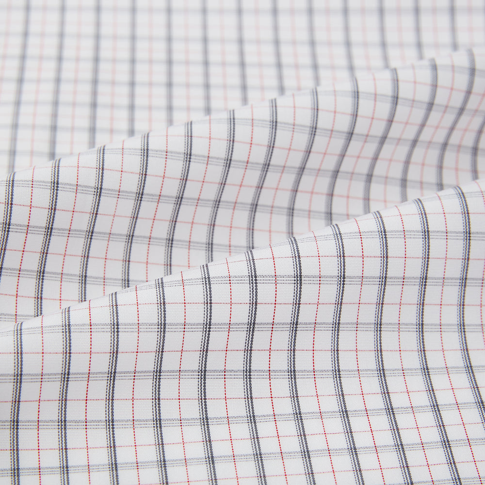 The Blue and Red Graph Check Westminster Shirt by Turnbull & Asser features a classic collar, long sleeves, and British craftsmanship, with a blue and red checkered pattern on white, displayed flat on a white surface.
