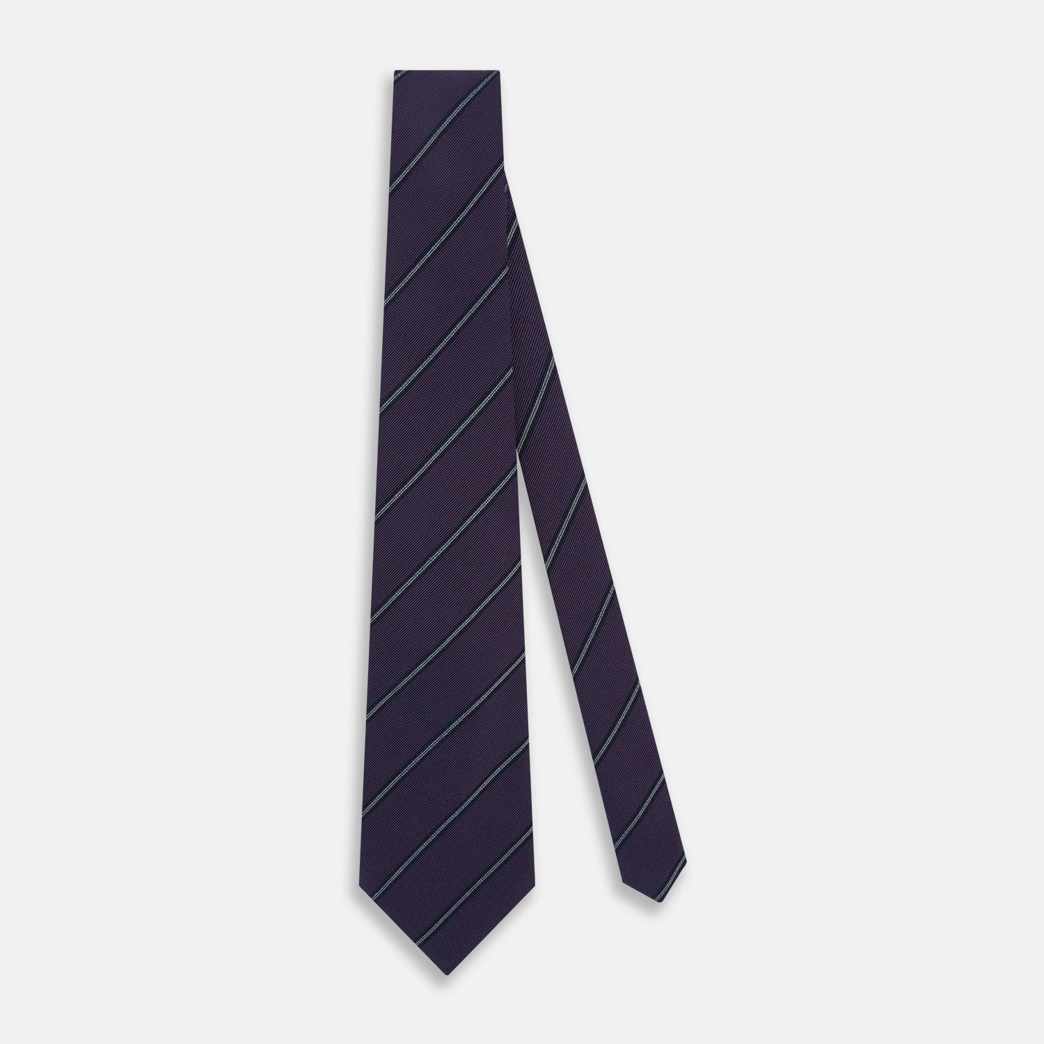 View 2 of product The Turnbull & Asser Purple Multi Stripe Silk Blend Tie, featuring thin light blue diagonal stripes, is neatly rolled on a white background.