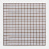 View 3 of product The Turnbull & Asser Hand Rolled Brown Overlay Check Handkerchief is a rectangular white cotton accessory with evenly spaced brown and black grid lines, forming squares—a timeless classic for gentlemen.