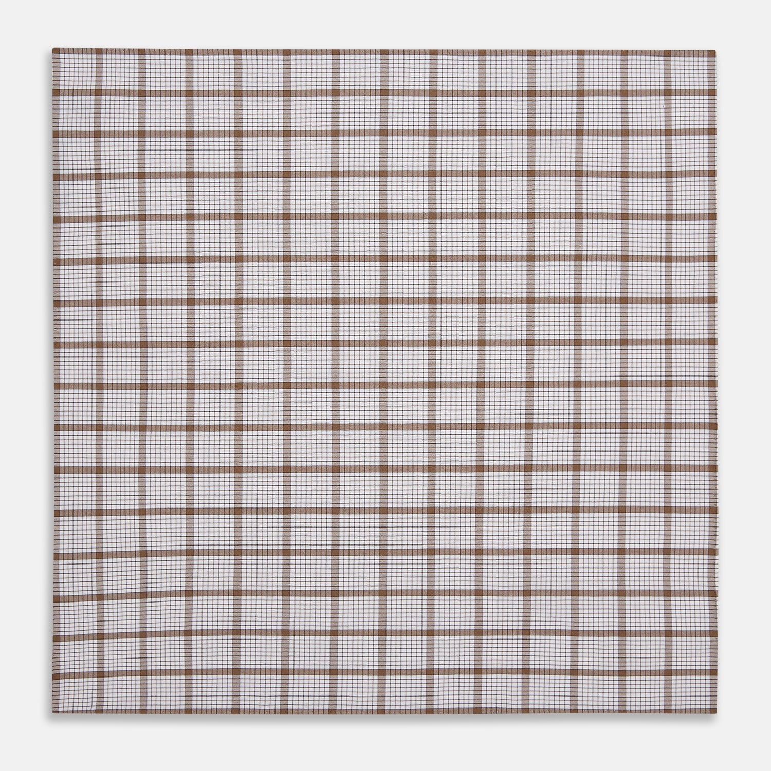 View 3 of product The Turnbull & Asser Hand Rolled Brown Overlay Check Handkerchief is a rectangular white cotton accessory with evenly spaced brown and black grid lines, forming squares—a timeless classic for gentlemen.