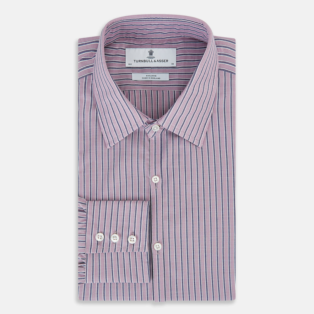 The Turnbull & Asser Antique Pink Ticking Stripe Westminster Shirt is a collared, long-sleeve button-up with thin vertical pink stripes on white, highlighting British craftsmanship. It’s shown neatly laid flat and fully buttoned.