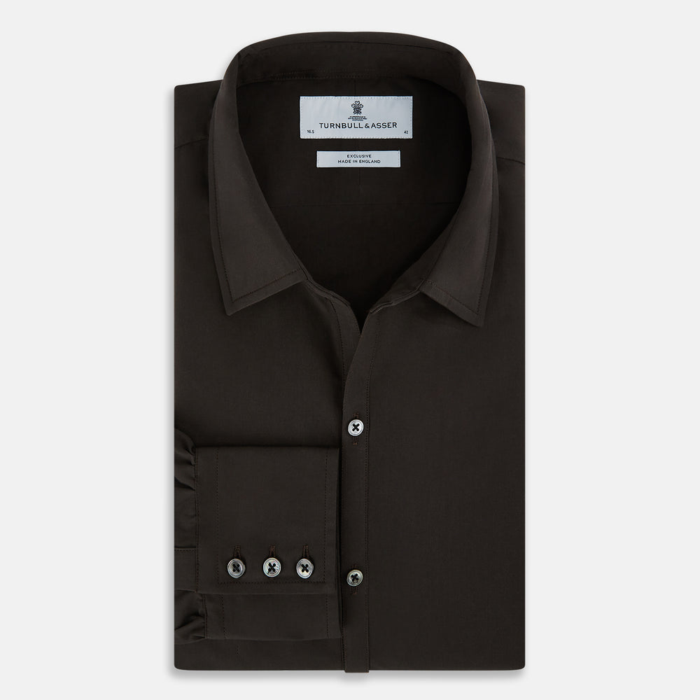 A brown Windsor long-sleeve button-up shirt by Turnbull & Asser with a classic collar, buttoned cuffs, and a straight hem, laid flat on a white background—showcasing refined British craftsmanship.