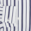 View 4 of product The Turnbull & Asser Navy Double Stripe Quarzo Nightshirt, a knee-length Italian cotton nightshirt with navy and white vertical stripes, collar, chest pocket, and button-down front, is displayed flat on a white background.