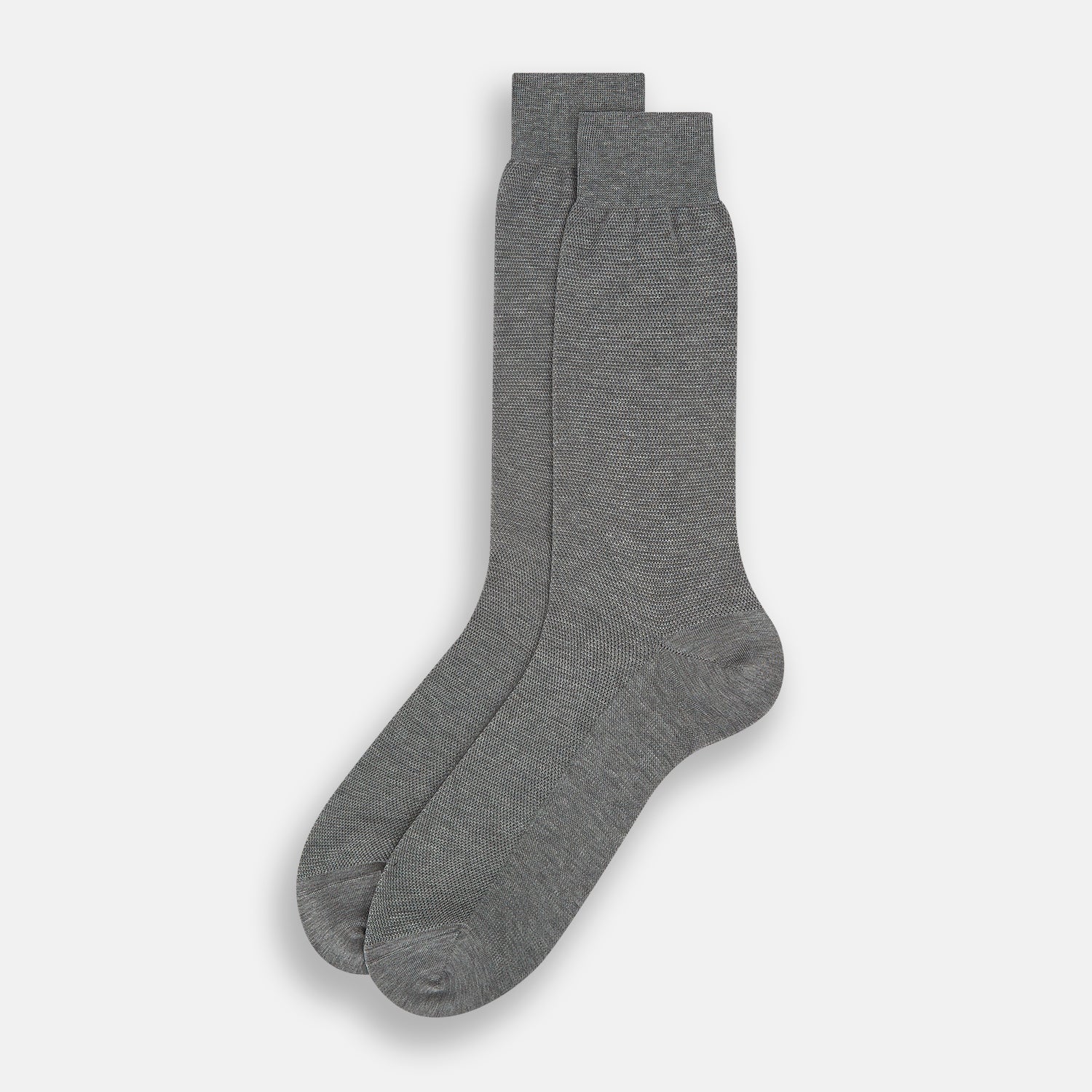 View 2 of product A single Steel Melange Micro Knit Mid-Length Sock by Turnbull & Asser, knee-high and gray, crafted from mercerised Egyptian cotton with a subtle micro knit pattern, is displayed upright on a plain white background.