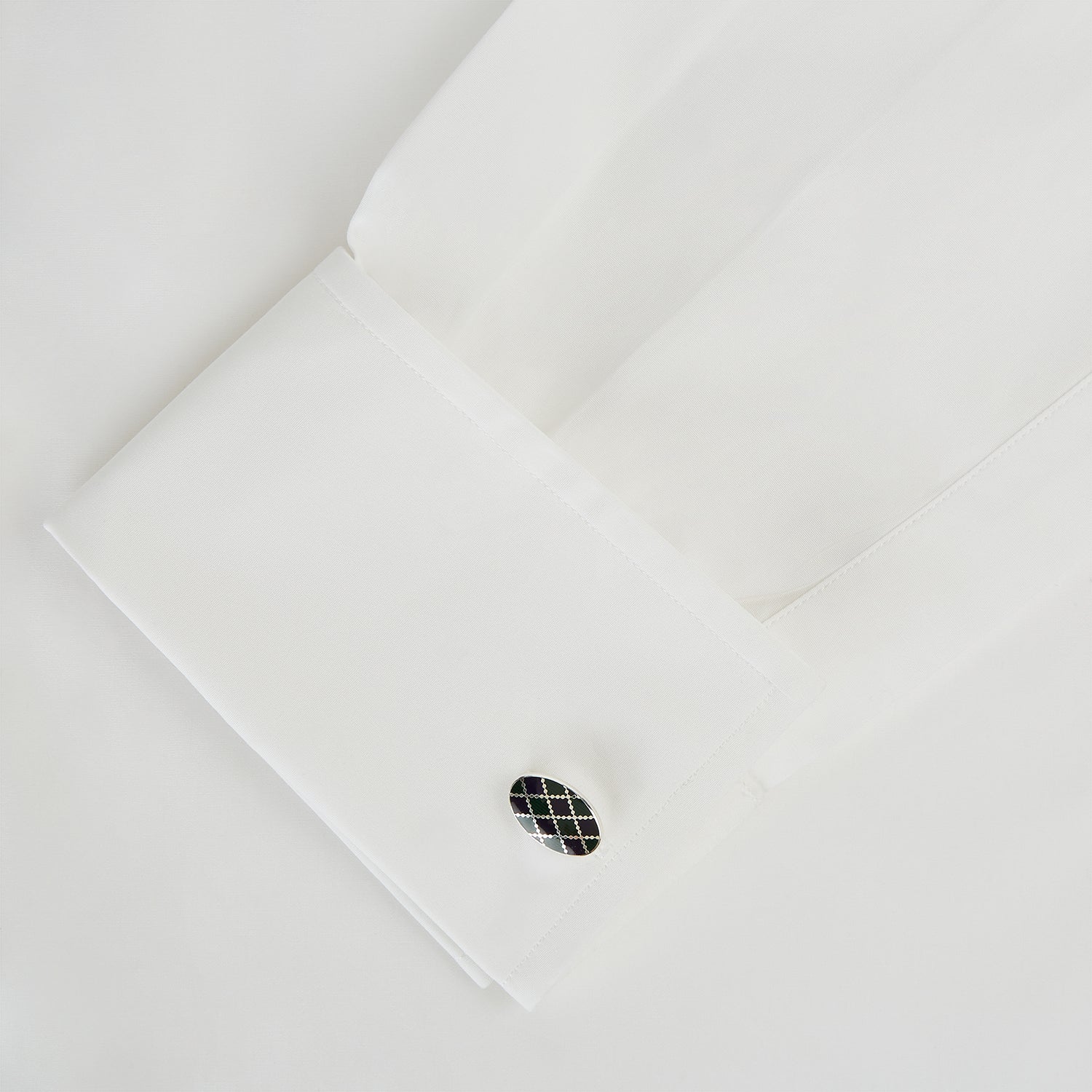 View 3 of product Turnbull & Asser's Forest Green and Navy Checkered Oval Enamel Chain Cufflinks offer masculine elegance with their striking enamel pattern against a refined silver finish.