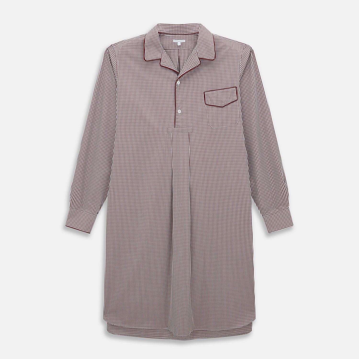 View 1 of product The Turnbull & Asser Burgundy Micro Check Winston Long Nightshirt is knee-length with long sleeves, brown and white micro checks, a collar, chest pocket with piping, and a front button placket.