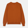 View 3 of product The Rust Lachlan Cashmere Cardigan by Turnbull & Asser features a V-neck, long sleeves, front button closure, and two front pockets—ideal for layering in smart-casual looks. Shown laid flat on a plain white background.