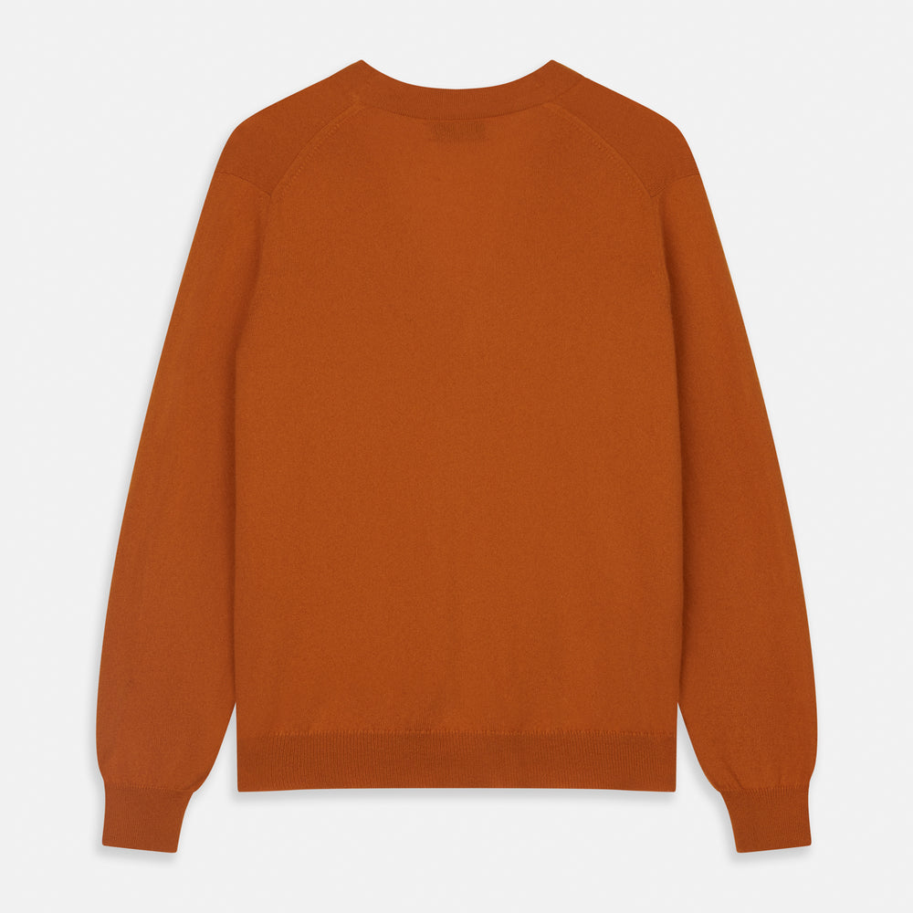 The Rust Lachlan Cashmere Cardigan by Turnbull & Asser features a V-neck, long sleeves, front button closure, and two front pockets—ideal for layering in smart-casual looks. Shown laid flat on a plain white background.