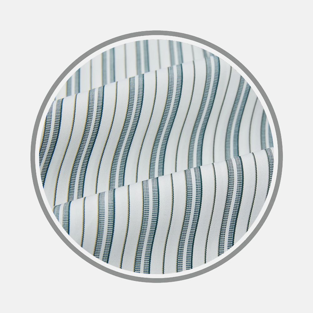 Close-up of Turnbull & Asser's Green Double Stripe Fabric, shown in a circular frame on a light background. The fabric features thin green double stripes and is slightly folded, highlighting its texture and pattern.