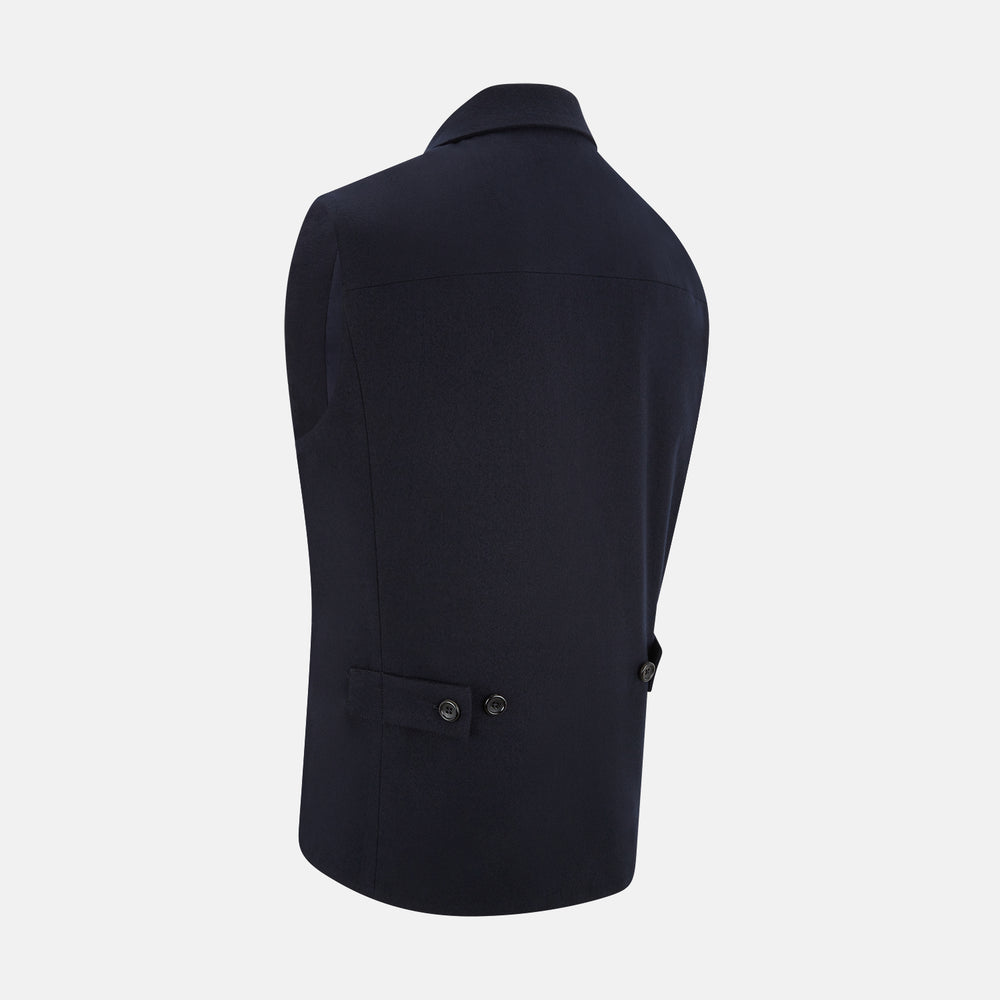 The Turnbull & Asser Navy Collared Single-breasted Waistcoat features a sleeveless design, wool-cashmere blend, two zippered side pockets, and a chest pocket—ideal for upgrading your winter look—shown on a white background.