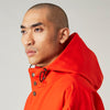 View 11 of product Wearing the Turnbull & Asser Red Walter Sealup Parka with Detachable Liner, black pants, and white sneakers, a person stands in profile against a plain light background—perfect for travel.
