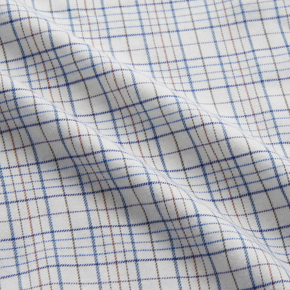 The Turnbull & Asser Blue Multi Check Cotton-Cashmere Modern Pyjama Set features a two-piece design with a long-sleeve button-up top with breast pocket and matching elastic-waist pants in a blue and white check pattern.