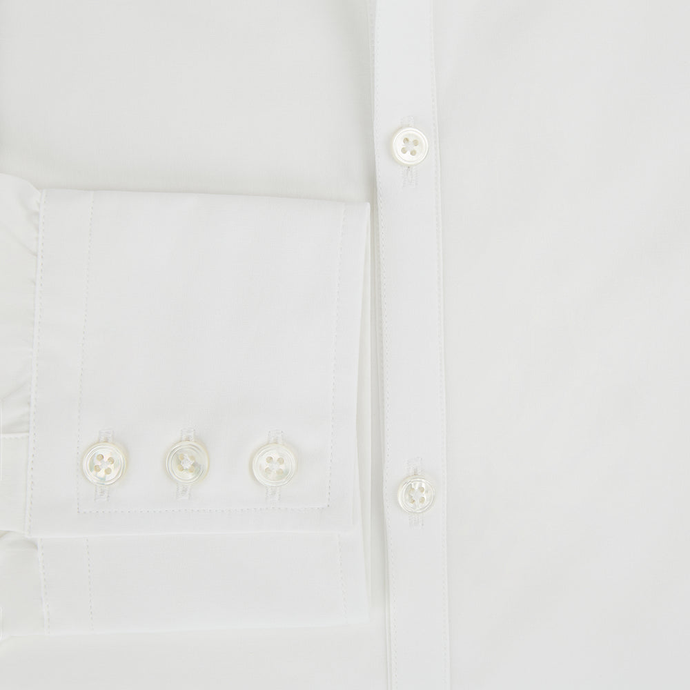 The Turnbull & Asser Plain White Windsor Shirt features a Turnbull open collar, 3-button cuffs, and relaxed fit—exemplifying British craftsmanship. Displayed on a white background.