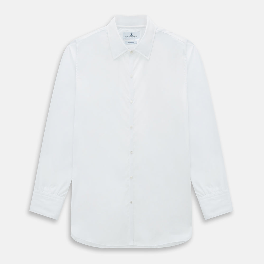 The PLAIN WHITE WESTMINSTER SHIRT WITH TURNBULL COLLAR AND 3-BUTTON CUFFS by Turnbull & Asser features refined British craftsmanship, long sleeves, a straight hem, and a crisp white design displayed on a plain background.