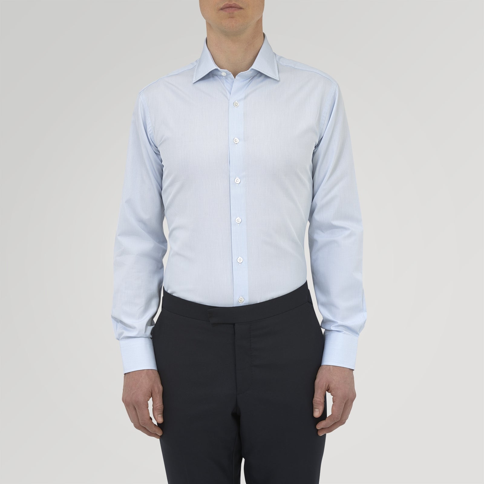 View 2 of product A Tailored Fit Blue Fine Bengal Stripe Shirt with a Kent Collar and 2-button cuffs by Turnbull & Asser, neatly folded and displayed against a plain white background.