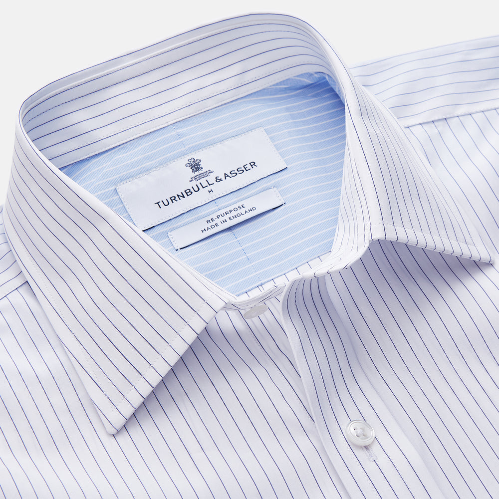 The White and Blue Stripe Cotton RE-PURPOSE Weekend Fit Finch Shirt by Turnbull & Asser features long sleeves, thin blue stripes, a light blue chest pocket, and is crafted sustainably.