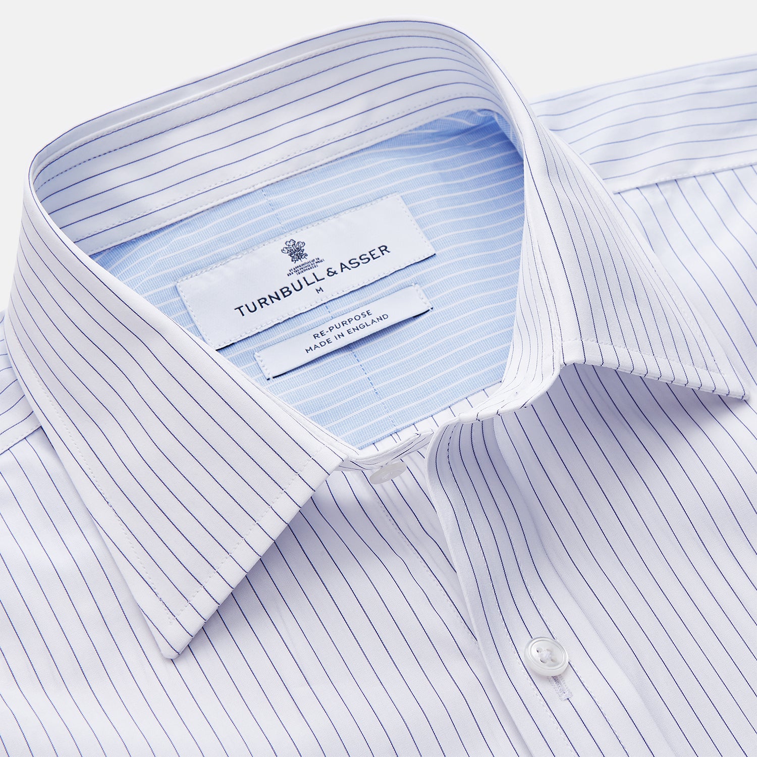 View 3 of product The White and Blue Stripe Cotton RE-PURPOSE Weekend Fit Finch Shirt by Turnbull & Asser features long sleeves, thin blue stripes, a light blue chest pocket, and is crafted sustainably.