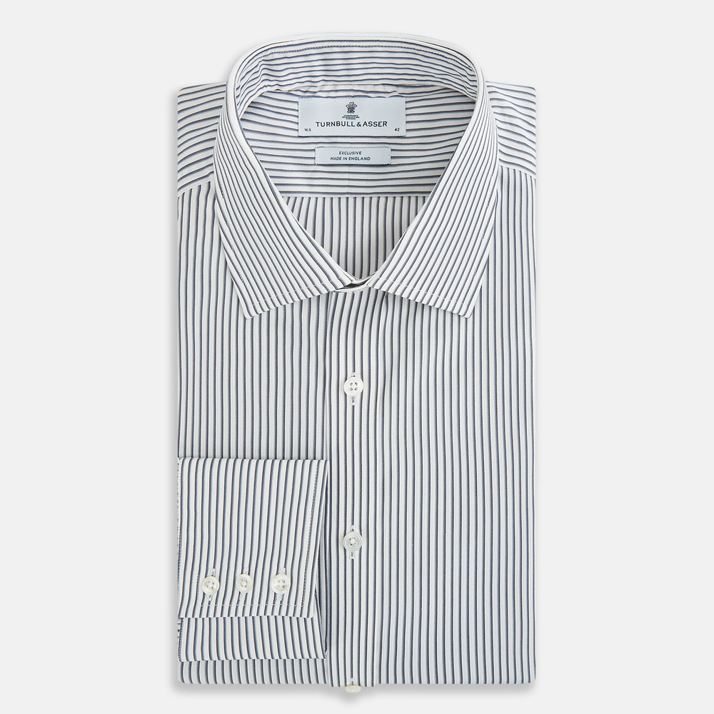 The Turnbull & Asser Grey Multi Stripe Mayfair Shirt features long sleeves, a classic collar, and thin vertical stripes in black and white, shown laid flat on a white background.
