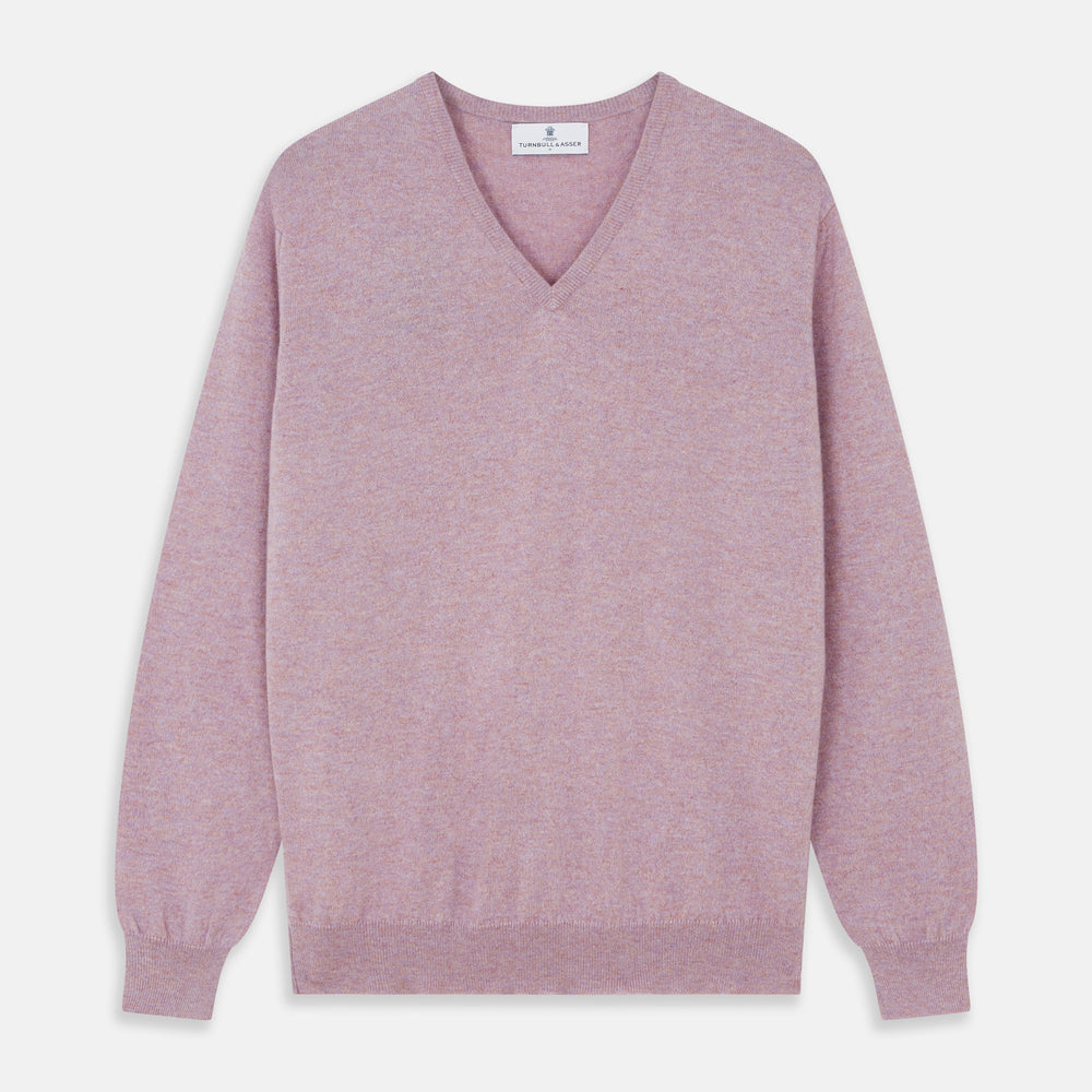 The Turnbull & Asser Lilac Heather Paden Cashmere V-Neck Jumper is laid flat on a white background, showcasing its light purple hue, ribbed cuffs and hem, long sleeves, and soft heathered texture.